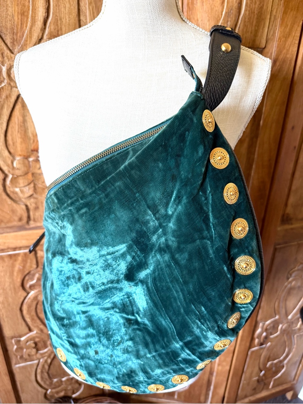 MAXX New York green velvet handbag with gold Medallion trim.